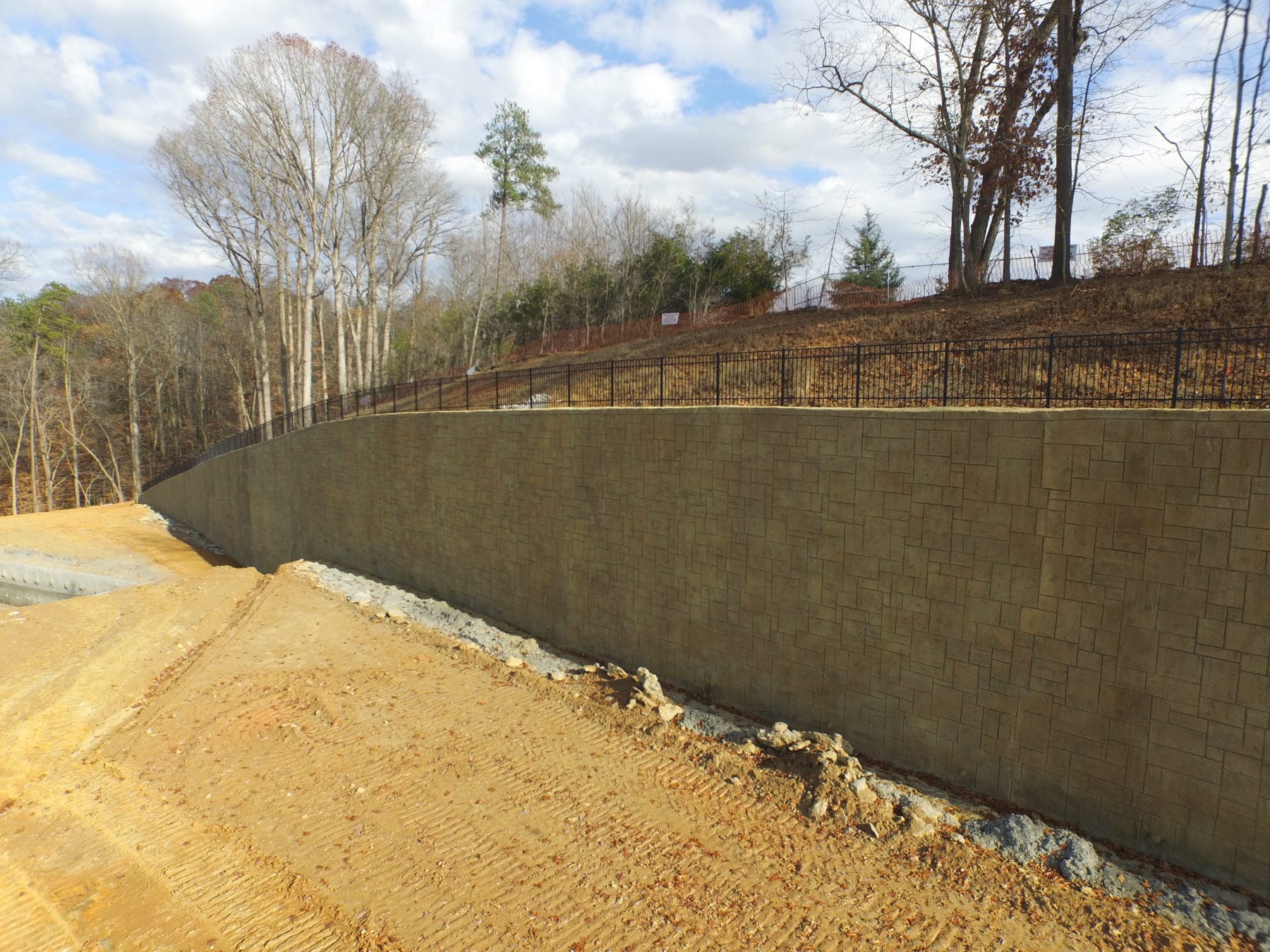 Waltonwood complex Wall with stained and carved Shotcrete Veneer