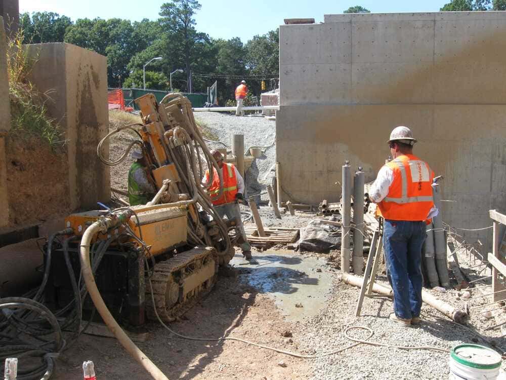 photo of a small drill rig installing micropoiles